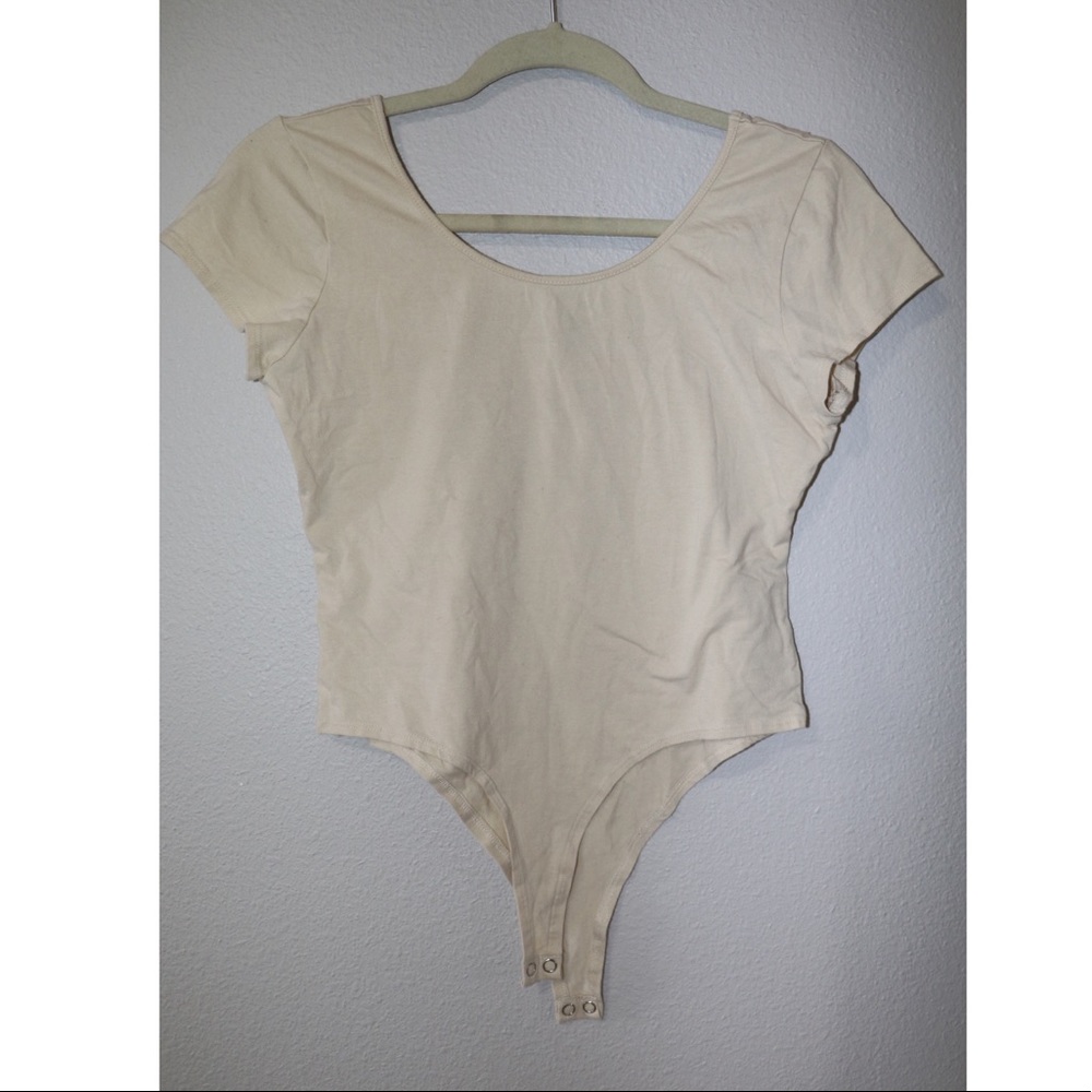 Beige short sleeve bodysuit top